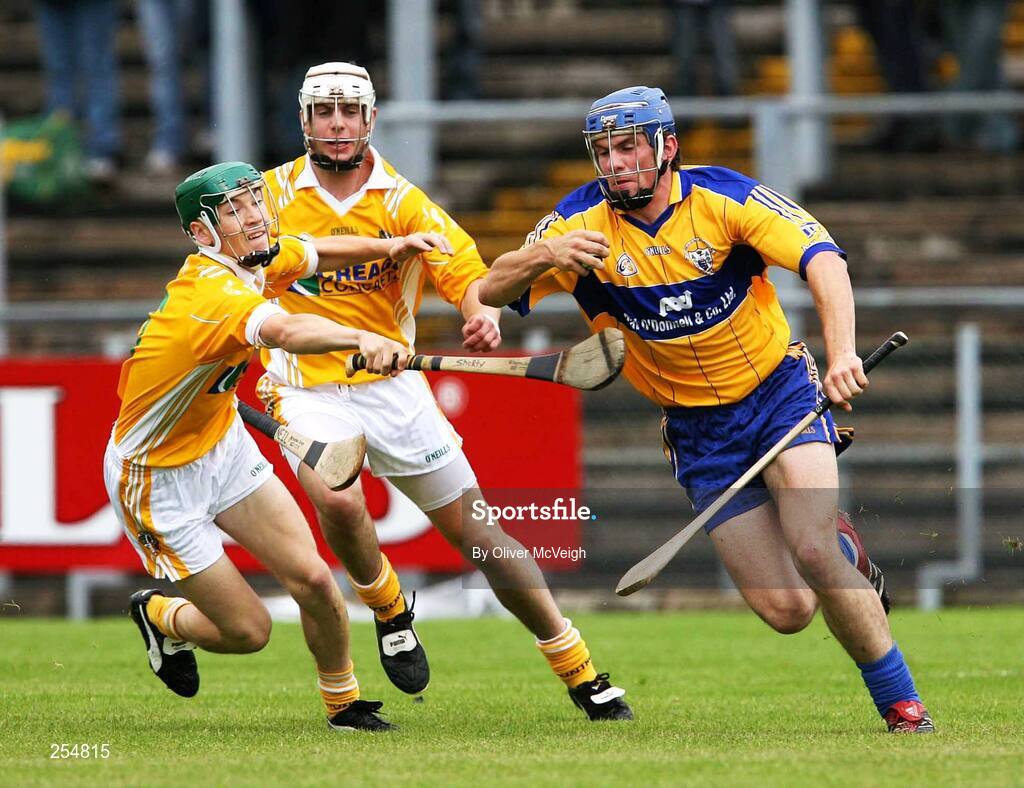 30 June 2007; James McInerney, Clare, in action against Neil McManus and Paul Shields, Antrim. Guinness All-Ireland Hurling Championship Qualifier, Group 1A, Round 1, Antrim v Clare, Casement Park, Belfast, Co. Antrim. Picture credit: Oliver McVeigh / SPORTSFILE