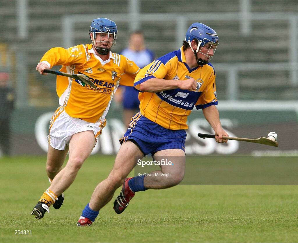 30 June 2007; James McInerney, Clare, in action against Shane McNaughton, Antrim. Guinness All-Ireland Hurling Championship Qualifier, Group 1A, Round 1, Antrim v Clare, Casement Park, Belfast, Co. Antrim. Picture credit: Oliver McVeigh / SPORTSFILE