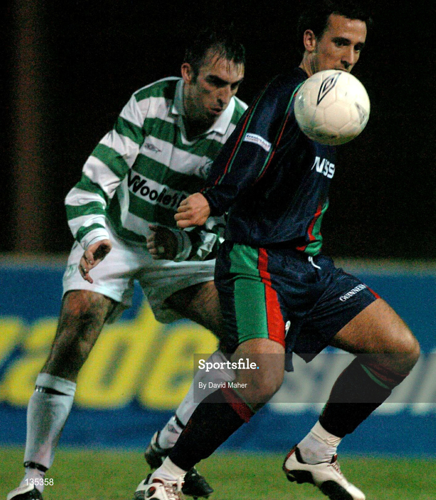 26 March 2004; Terry Palmer of Shamrock Rovers in action against Neale Fenn of Cork City during the Eircom League Premier Division match between Shamrock Rovers and Cork City at Richmond Park in Dublin. Photo by David Maher/Sportsfile