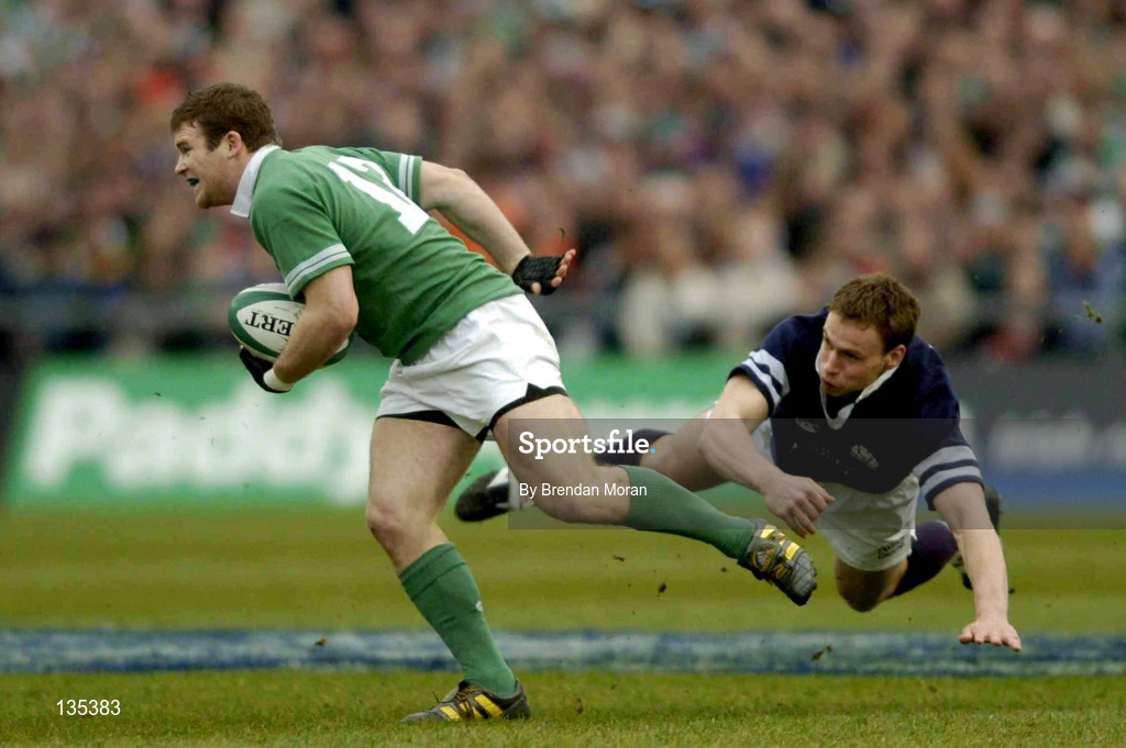 27 March 2004; Gordon D'Arcy of Ireland escapes the tackle of Andrew Henderson of Scotland as he races towards the try line during the RBS Six Nations Rugby Championship match between Ireland and Scotland at Lansdowne Road in Dublin. Photo by Brendan Moran/Sportsfile