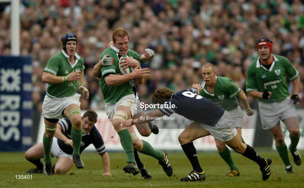 27 March 2004; Paul O'Connell of Ireland is tackled by Scotland players Chris Cusiter, 9, and Simon Webster during the RBS Six Nations Rugby Championship match between Ireland and Scotland at Lansdowne Road in Dublin. Photo by Brendan Moran/Sportsfile
