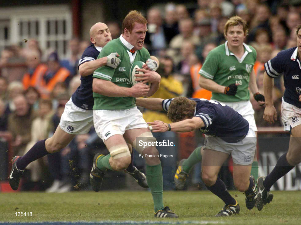 27 March 2004; Paul O'Connell of Ireland is tackled by Simon Webster, left, and Chris Cusiter of Scotland during the RBS Six Nations Rugby Championship match between Ireland and Scotland at Lansdowne Road in Dublin. Photo by Damien Eagers/Sportsfile