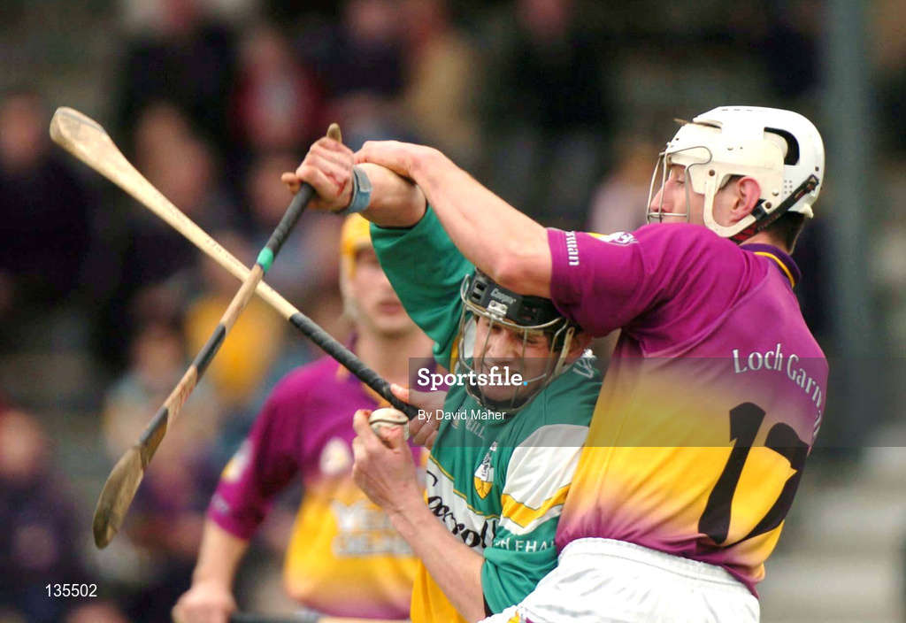 28 March 2004; Rory Hanniffy of Offaly is tackled by David O'Connor of Wexford during the Allianz Hurling League Division 1B match between Offaly and Wexford at St. Brendan's Park in Birr, Offaly. Photo by David Maher/Sportsfile