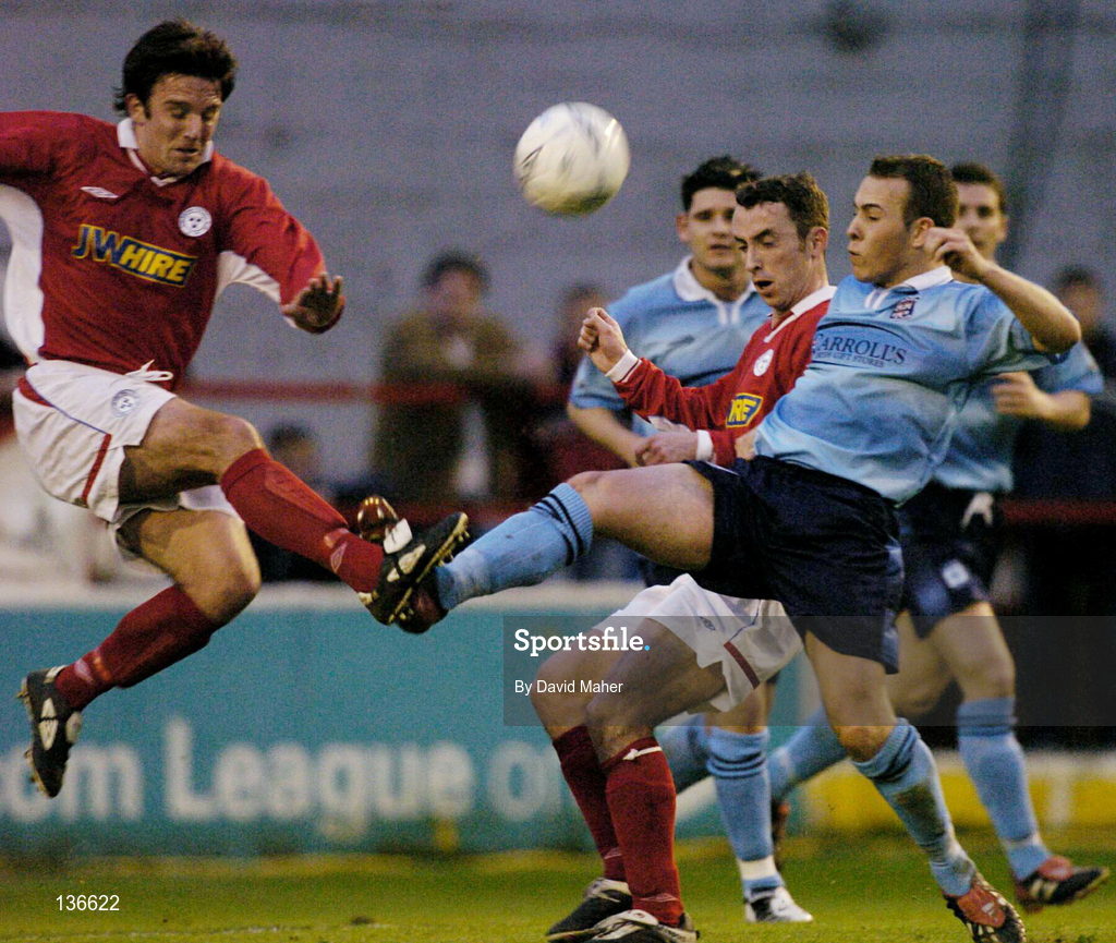 9 April 2004; Ray Scully of Dublin City in action against Stuart Byrne, left, and Ollie Cahill of Shelbourne during the Eircom League Premier Division match between Shelbourne and Dublin City at Tolka Park in Dublin. Photo by David Maher/Sportsfile