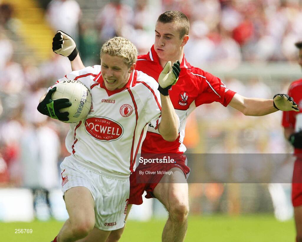 15 July 2007; Peter Hughes, Tyrone, in action against Brendan Henry, Derry . ESB Ulster Minor Football Championship Final - Derry v Tyrone, St Tighearnach's Park, Clones, Co Monaghan. Picture credit: Oliver McVeigh / SPORTSFILE