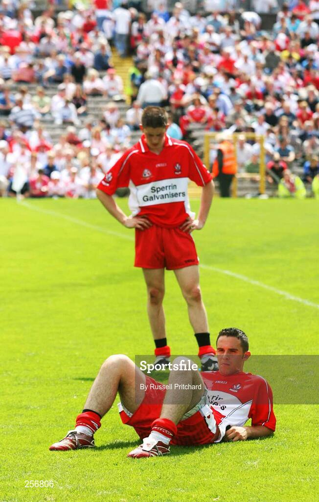15 July 2007; Derry's Declan Mullen sits and reflects along with team-mate  Aidan Herron after the final whistle. ESB Ulster Minor Football Championship Final - Derry v Tyrone, St Tighearnach's Park, Clones, Co Monaghan. Picture credit: Russell Pritchard / SPORTSFILE