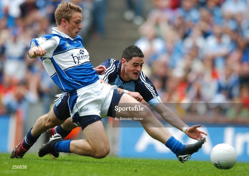 15 July 2007; Laois's Ross Munnelly scores his side's first goal despite the best efforts of Dublin's Ross McConnell. Bank of Ireland Leinster Senior Football Championship Final, Dublin v Laois, Croke Park, Dublin. Picture credit: Brendan Moran / SPORTSFILE