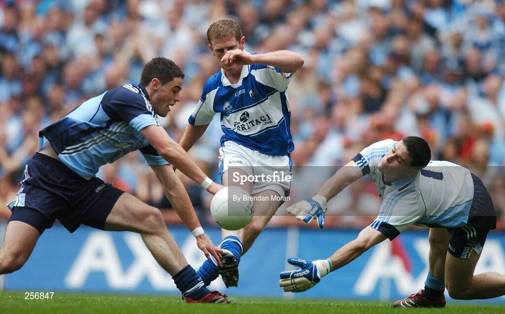 15 July 2007; Laois's Brian McDonald has his shot blocked by Ross McConnell, left, and Stephen Cluxton, Dublin, the rebound resulted in Ross Munnelly, Laois, scoring their side's first goal. Bank of Ireland Leinster Senior Football Championship Final, Dublin v Laois, Croke Park, Dublin. Picture credit: Brendan Moran / SPORTSFILE