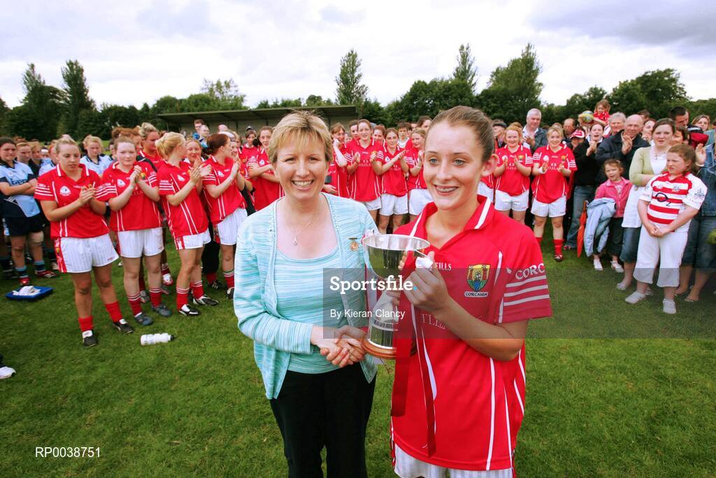 15 July 2007; Uachtaran Cumann Peil Gael na mBan Geraldine Giles presents the cup to Cork captain Roisin O'Sullivan. TG4 Ladies All-Ireland Minor Football Final, Dublin v Cork, JJ Brackens GAA Club, Templemore, Co. Tipperary. Picture credit: Kieran Clancy / SPORTSFILE