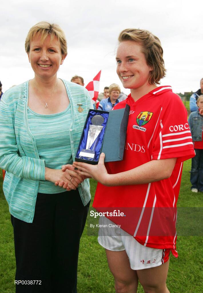 15 July 2007; Uachtaran Cumann Peil Gael na mBan Geraldine Giles presents the player of the match award to Cork's Sile Johnson. TG4 Ladies All-Ireland Minor Football Final, Dublin v Cork, JJ Brackens GAA Club, Templemore, Co. Tipperary. Picture credit: Kieran Clancy / SPORTSFILE