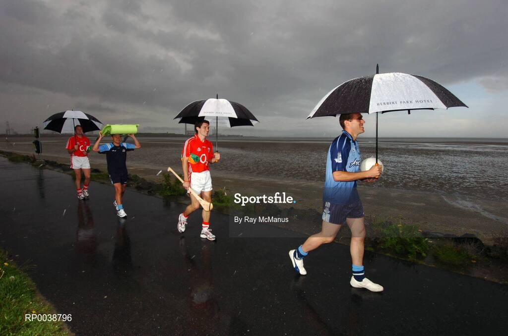 17 July 2007; Dublin footballers Jason Sherlock, second from left, and Ciaran Whelan, right, Cork hurler Tom Kenny, and Cork footballer James Masters, left, who were announced as Ariel GAA Championship Bright Ambassadors for 2007 arrive for the photocall on Sandymount beach. This summer, Ariel is giving away free exclusive GAA towels with promotional packs. Martello Tower, Sandymount Strand, Dublin. Picture credit: Ray McManus / SPORTSFILE