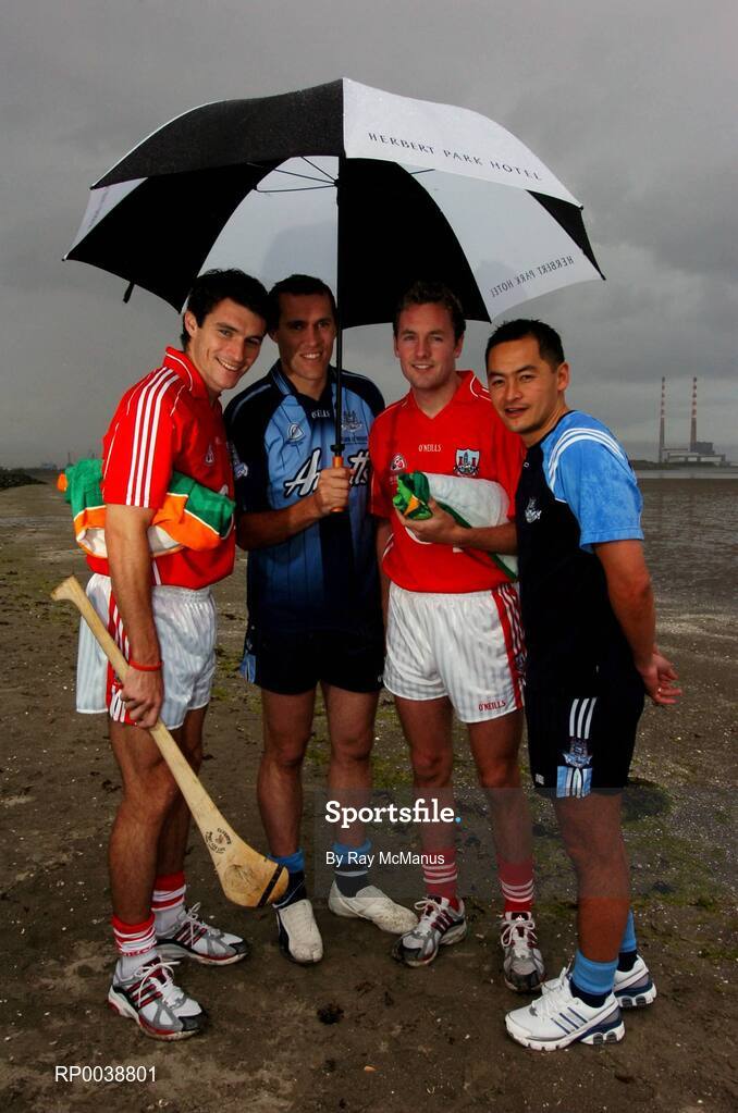 17 July 2007; Dublin footballers Jason Sherlock, right, and Ciaran Whelan, Cork hurler Tom Kenny, left, and Cork footballer James Masters, were announced as Ariel GAA Championship Bright Ambassadors for 2007. This summer, Ariel is giving away free exclusive GAA towels with promotional packs. Martello Tower, Sandymount Strand, Dublin. Picture credit: Ray McManus / SPORTSFILE