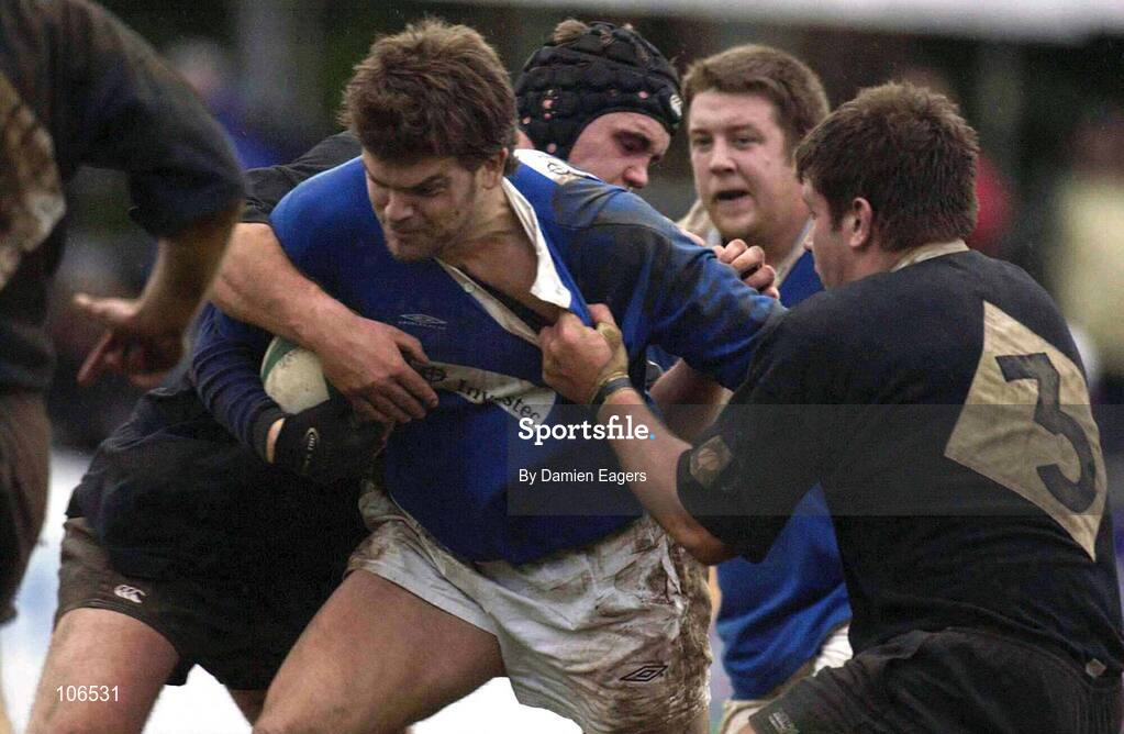 8 February 2003; John McWeeney, St. Mary's, is tackled by Ballymena players Matt McCullough, left and Brian Young, 3. St Marys v Ballymena, AIL League Division 1, Templeville Road, Rugby, Dublin. RugbyPicture credit; Pat Murphy / SPORTSFILE