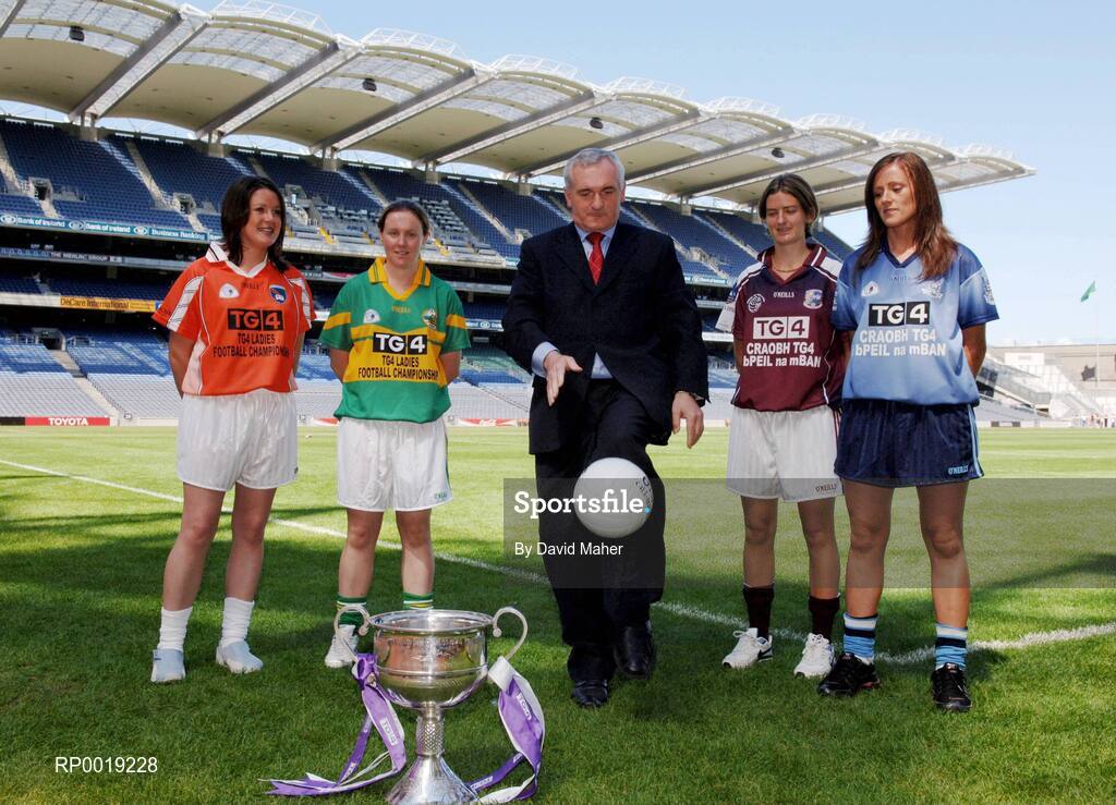 11 July 2005; An Taoiseach, Bertie Ahern TD, shows his football skills with players left to right, Aileen Mathews, Armagh, Elaine Duffy, Kerry, Aoibhean Daly, Galway, and Niamh McEvoy, Dublin, at the launch of the 2005 TG4 All-Ireland Ladies Football Championship. Croke Park, Dublin. Picture credit; David Maher / SPORTSFILE