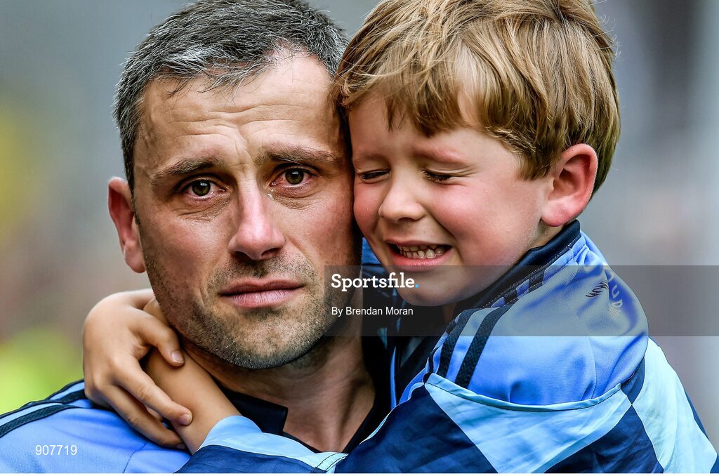 31 August 2014; A tearful Alan Brogan of Dublin leaves the pitch with his son Jamie after defeat by Donegal. GAA Football All Ireland Senior Championship, Semi-Final, Dublin v Donegal, Croke Park, Dublin. Picture credit: Brendan Moran / SPORTSFILE