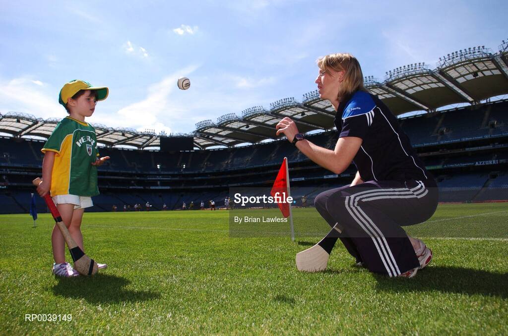 31 July 2007; Croke Park became a theatre of dreams today as over 250 young Camogie stars of the future enjoyed a first experience of playing on the hallowed turf. U-14 players on the Coillte Development Squads from Clare, Derry, Kerry, Laois, Louth, Monaghan, Tipperary and Westmeath were granted the rare opportunity to hone their skills at headquarters as part of the Camogie Association’s national programme to develop the sport at juvenile level. The partnership with Coillte, supported by the Irish Sports Council, enables top level coaching and encouragement for young girls throughout the eight designated counties. At the tournament is Cork camogie star Mary O'Connor, Director of Camogie Development, with Caoimhe Spillane, age 5, from Abbeydorney, Kerry. 2007 Coillte U14 Camogie Development Squads tournament, Croke Park, Dublin. Picture credit: Brian Lawless / SPORTSFILE