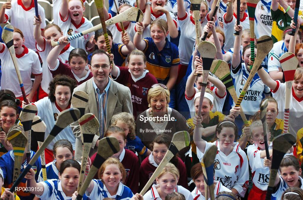 31 July 2007; Croke Park became a theatre of dreams today as over 250 young Camogie stars of the future enjoyed a first experience of playing on the hallowed turf.  U-14 players on the Coillte Development Squads from Clare, Derry, Kerry, Laois, Louth, Monaghan, Tipperary and Westmeath were granted the rare opportunity to hone their skills at headquarters as part of the Camogie Association’s national programme to develop the sport at juvenile level. The partnership with Coillte, supported by the Irish Sports Council, enables top level coaching and encouragement for young girls throughout the eight designated counties. At the tournament is Liz Howard, President of the Camogie Association, and Tom Byrne, Head of Corporate Communications, Coillte, with young Camogie players. 2007 Coillte U14 Camogie Development Squads tournament, Croke Park, Dublin. Picture credit: Brian Lawless / SPORTSFILE