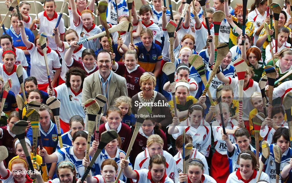 31 July 2007; Croke Park became a theatre of dreams today as over 250 young Camogie stars of the future enjoyed a first experience of playing on the hallowed turf.  U-14 players on the Coillte Development Squads from Clare, Derry, Kerry, Laois, Louth, Monaghan, Tipperary and Westmeath were granted the rare opportunity to hone their skills at headquarters as part of the Camogie Association’s national programme to develop the sport at juvenile level. The partnership with Coillte, supported by the Irish Sports Council, enables top level coaching and encouragement for young girls throughout the eight designated counties. At the tournament is Liz Howard, President of the Camogie Association, and Tom Byrne, Head of Corporate Communications, Coillte, with young Camogie players. 2007 Coillte U14 Camogie Development Squads tournament, Croke Park, Dublin. Picture credit: Brian Lawless / SPORTSFILE