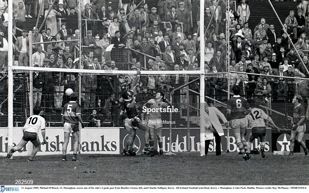 11 August 1985; Michael O'Dowd of Monaghan, 12, scores one of his side's 2 goals past Eoin Bomber Liston, left, and Charlie Nelligan of Kerry during the All-Ireland Football semi-final match between Kerry and Monaghan at Croke Park, Dublin. Photo by Ray McManus/Sportsfile