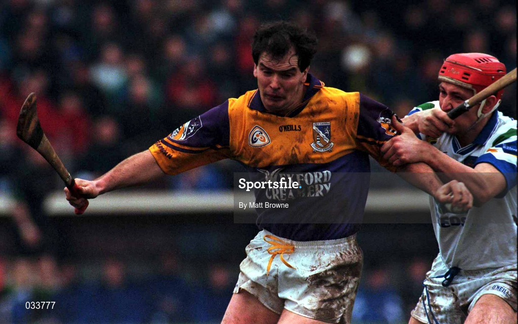 27 February 2000; Adrian Fenlon of Wexford is tackled by Johnny Brenner of Waterford during the Church & General National Hurling League Division 1B Round 2 match between Waterford and Wexford at Walsh Park in Waterford. Photo by Matt Browne/Sportsfile