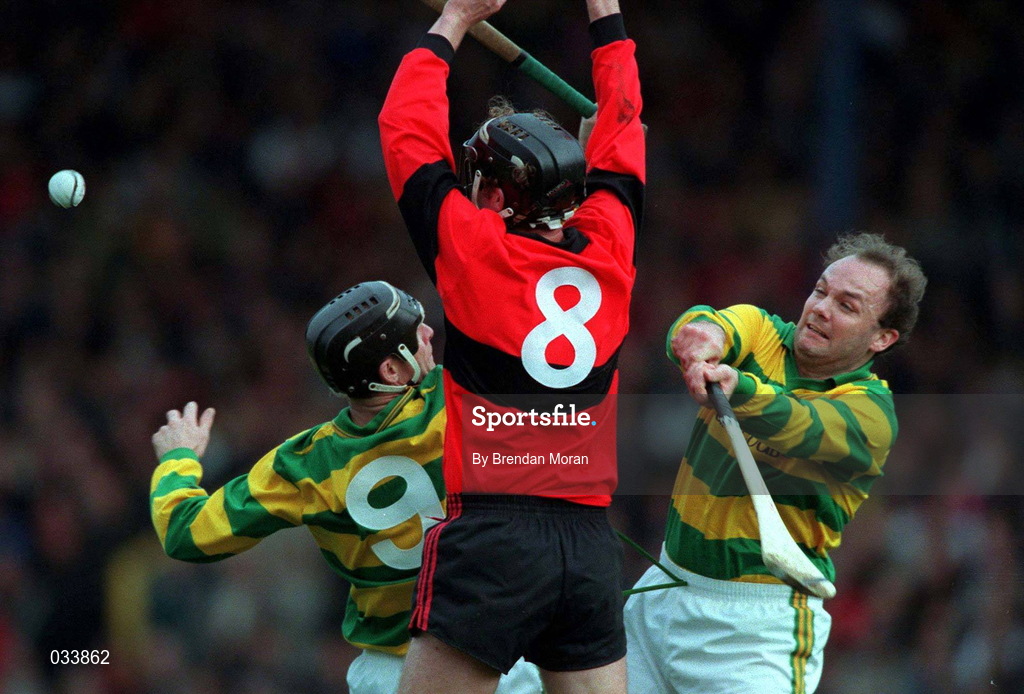 31 October 1999; Eddie Enright of UCC in action against Michael Harrington, left, and Liam Meaney of Blackrock during the Cork County Senior Club Hurling Championship Final match between Blackrock and UCC at Páirc Uí Chaoimh in Cork. Photo by Brendan Moran/Sportsfile