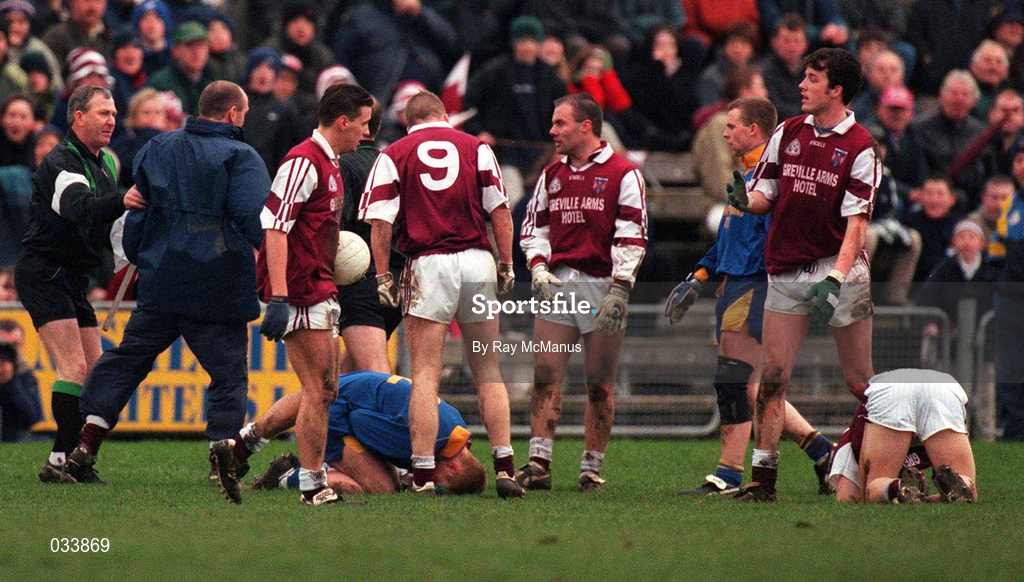 6 February 2000; Westmeath manager Brendan Lowry is restrained by the linesman as he has words with referee Gay McCabe after Dessie Dolan of Westmeath, on ground, had received an injury during the O'Byrne Cup Final between Westmeath and Longford at Cusack Park in Mullingar, Westmeath. Photo by Ray McManus/Sportsfile