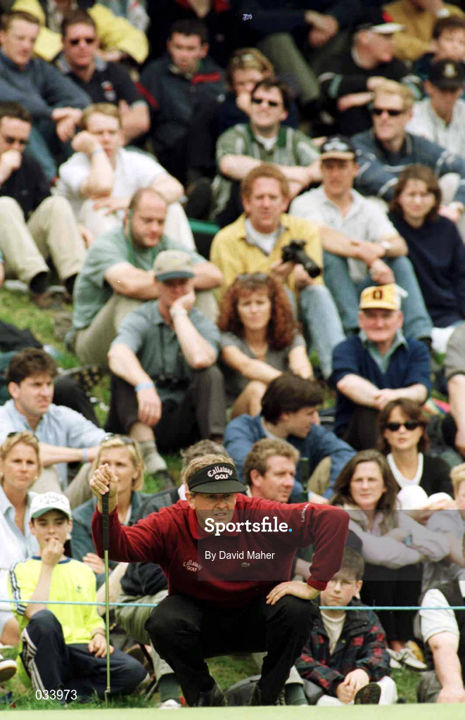 3 July 1999; Colin Montgomerie lines up a putt watched by the gallery during day three of the Murphy's Irish Open at Druids Glen in Wicklow. Photo by David Maher/Sportsfile
