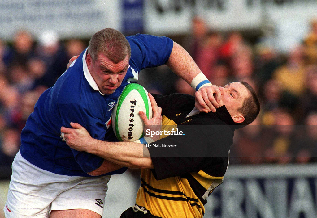 26 February 2000; Victor Costello of St Mary's fends off Leo Doyle of Young Munster during the AIB League Division 1 match between St Mary's and Young Munster at Templeville Road in Dublin. Photo by Matt Browne/Sportsfile