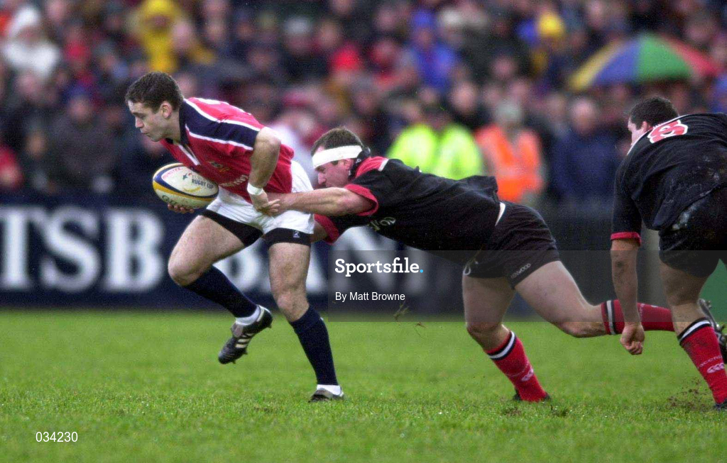 8 January 2000; Tom Tierney of Munster is tackled by Richard Hill of Saracens during the Heineken Cup Pool 4 Round 5 match between Munster and Saracens at Thomond Park in Limerick. Photo by Matt Browne/Sportsfile