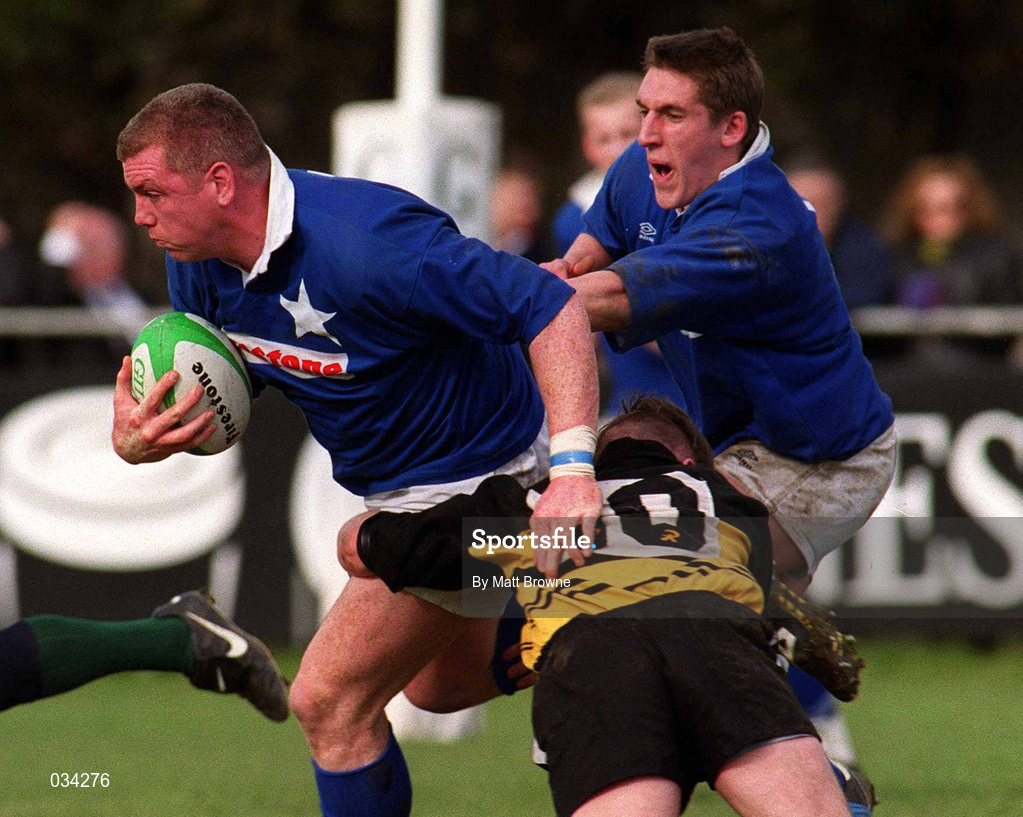 26 February 2000; Victor Costello of St Mary's is tackled by Eamon Buckley of Young Munster during the AIB League Division 1 match between St Mary's and Young Munster at Templeville Road in Dublin. Photo by Matt Browne/Sportsfile