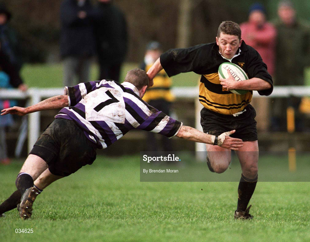 12 February 2000; James Carey of Young Munster is tackled by Peter O'Malley of Terenure College during the AIB League Division 1 match between Young Munster and Terenure College at Tom Clifford Park in Limerick. Photo by Brendan Moran/Sportsfile