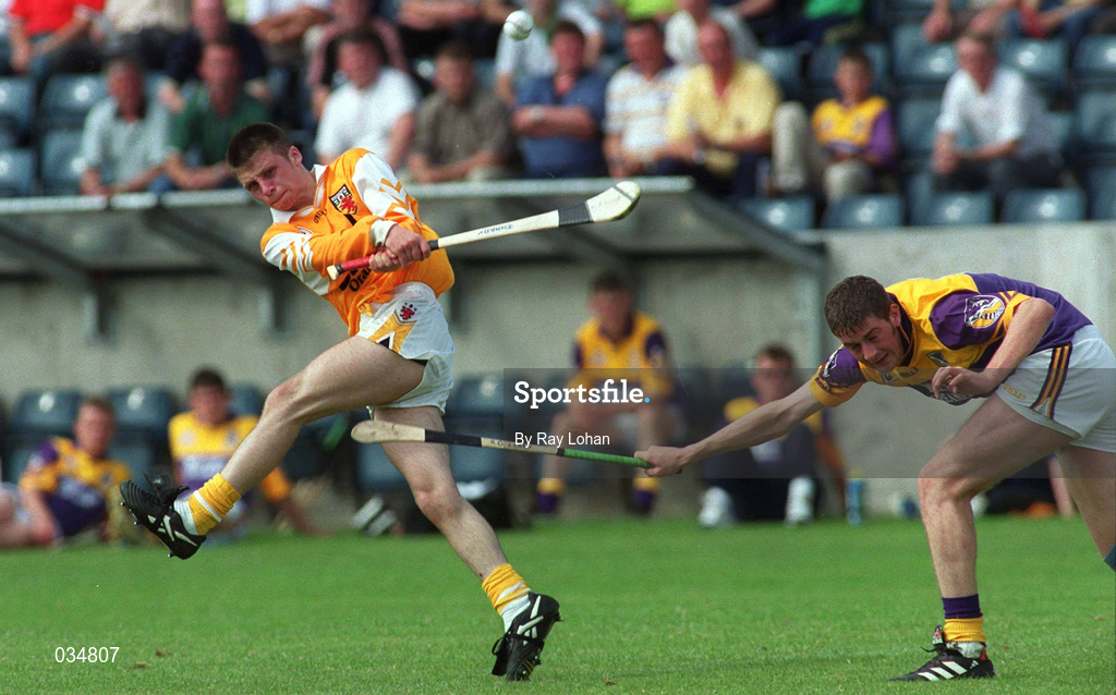 24 July 1999; Michael McClements of Antrim in action against Anthohy O'Leary of Wexford during the All-Ireland Minor Hurling Championship Quarter-Final match between Antrim and Wexford at Parnell Park in Dublin. Photo by Ray Lohan/Sportsfile