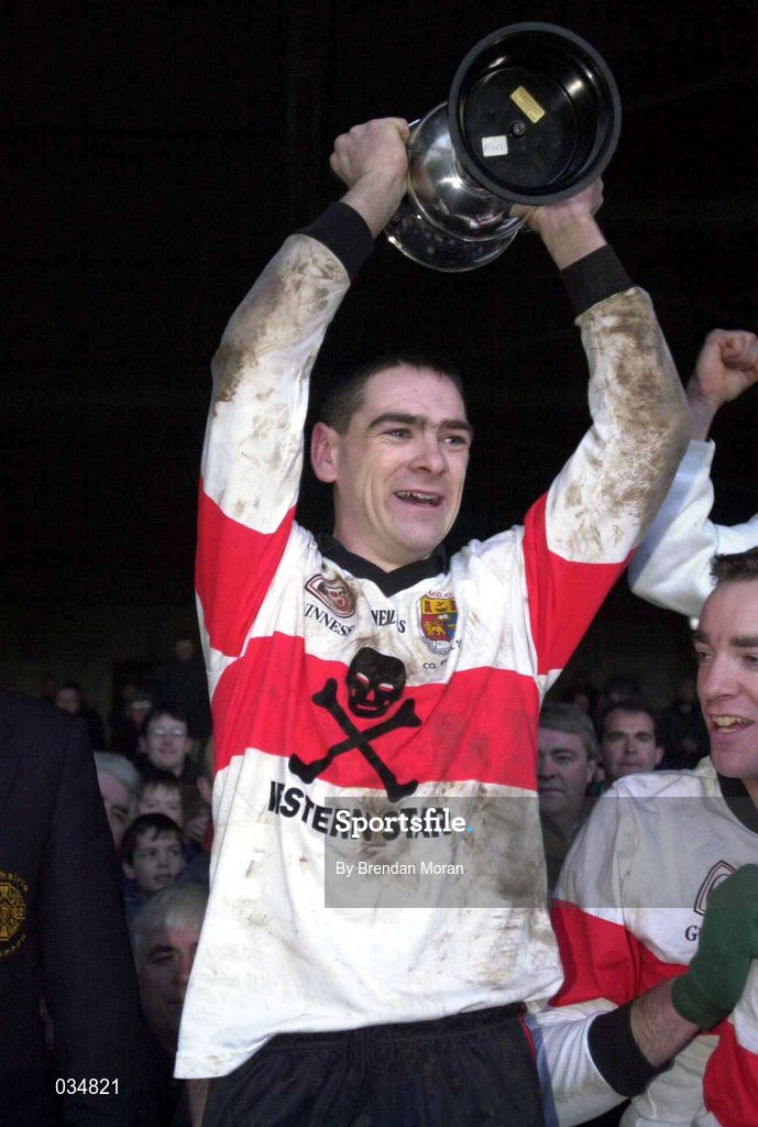 12 December 1999; UCC captain Michéal O Cróinín lifts the cup after the AIB Munster Senior Club Football Championship Final match between UCC and Doonbeg at the Gaelic Grounds in Limerick. Photo by Brendan Moran/Sportsfile