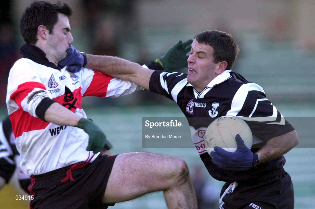 12 December 1999; Padraig Gallagher of Doonbeg holds off the challenge of Ian Twiss of UCC during the AIB Munster Senior Club Football Championship Final match between UCC and Doonbeg at the Gaelic Grounds in Limerick. Photo by Brendan Moran/Sportsfile
