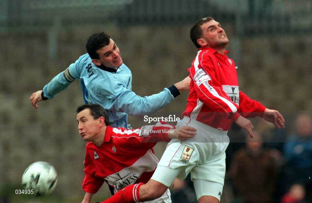 5 December 1999; Pat Scully of Shelbourne in action against John Caulfield, left, and Pat Morley of Cork City during the Eircom League Premier Division match between Cork City and Shelbourne at Turners Cross in Cork. Photo by David Maher/Sportsfile
