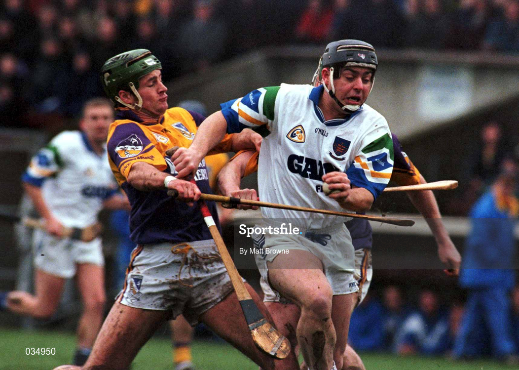 27 February 2000; Paul Flynn of Waterford is tackled by Declan Rush of Wexford during the Church & General National Hurling League Division 1B Round 2 match between Waterford and Wexford at Walsh Park in Waterford. Photo by Matt Browne/Sportsfile