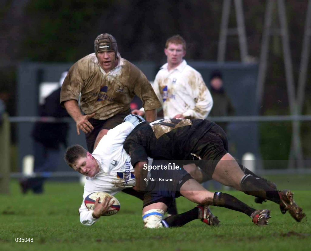 12 February 2000; Ronan O'Gara of Cork Constitution is tackled by Rhys Botha of Ballymena during the AIB League Division 1 match between Ballymena and Cork Constitution at Eaton Park in Ballymena, Antrim. Photo by Matt Browne/Sportsfile