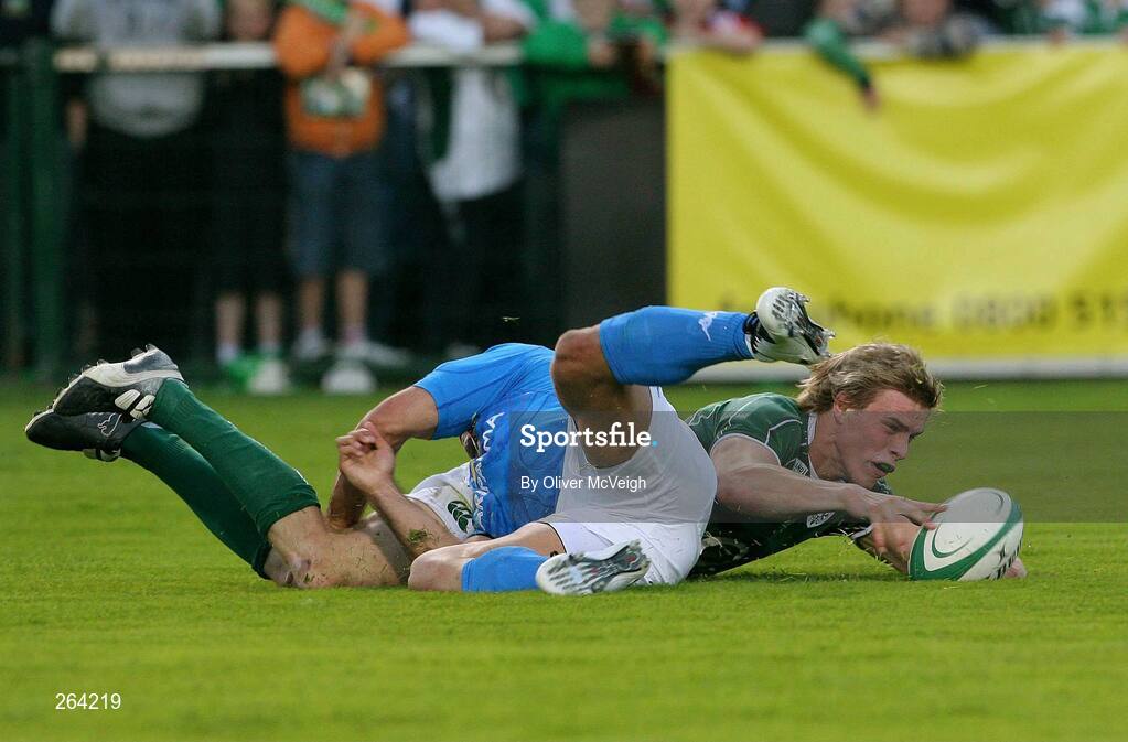24 August 2007; Ireland's Andrew Trimble scores his side's  first try despite the tackle of Italy's Gonzalo Canale. Rugby World Cup Warm-Up Game, Ireland v Italy, Ravenhill Park, Belfast, Co. Antrim. Picture credit: Oliver McVeigh / SPORTSFILE