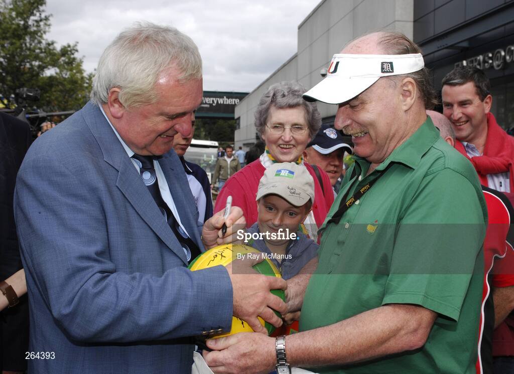 26 August 2007; An Taoiseach Bertie Ahern, T.D. wearing a 'Dublin tie' signs a football for Kerry supporter John Aherne, from Castleisland, before the game. Bank of Ireland All-Ireland Senior Football Championship Semi Final, Dublin v Kerry, Croke Park, Dublin. Picture credit: Ray McManus / SPORTSFILE