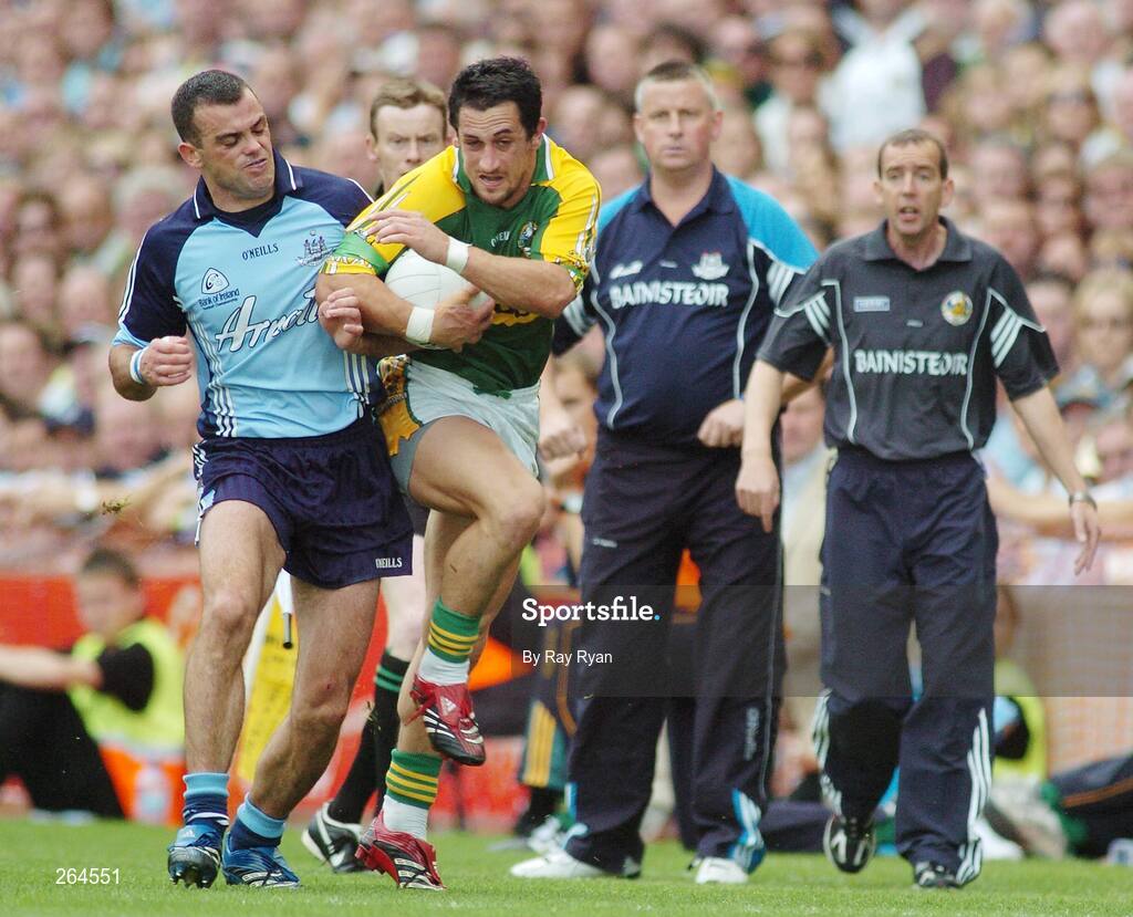 26 August 2007; Paul Casey, Dublin, in action against Paul Galvin, Kerry, under the watchful eyes of managers Paul Caffrey and Pat O'Shea. Bank of Ireland All-Ireland Senior Football Championship Semi Final, Dublin v Kerry, Croke Park, Dublin. Picture credit: Ray Ryan / SPORTSFILE