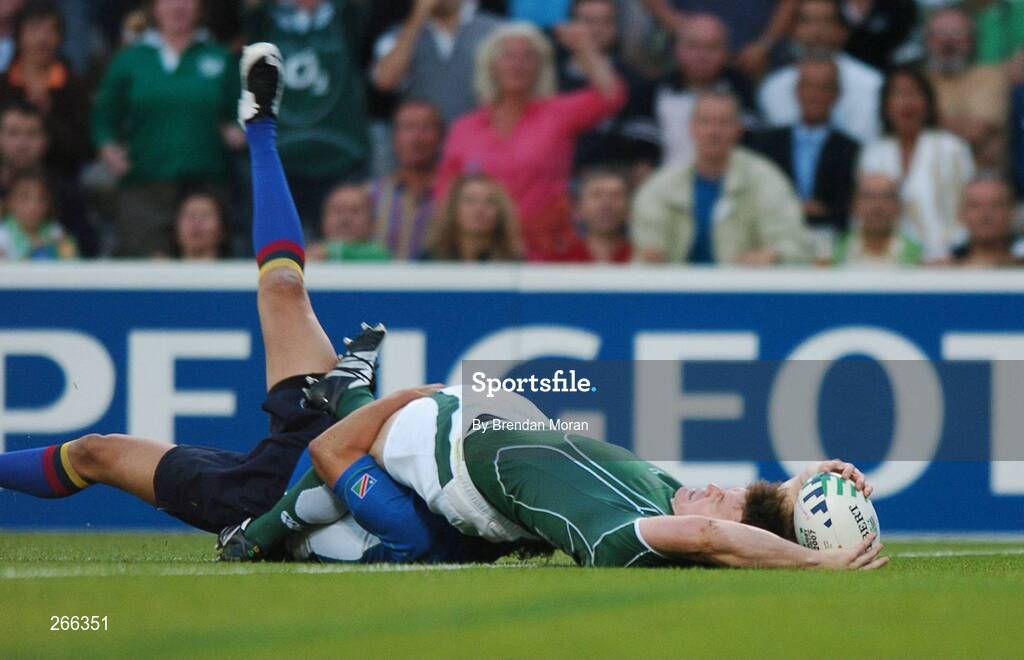9 September 2007; Brian O'Driscoll, Ireland, scores his side's first try despite the tackle of Tertius Losper, Namibia. 2007 Rugby World Cup, Pool D, Ireland v Namibia, Stade Chaban Delmas, Bordeaux, France. Picture credit; Brendan Moran / SPORTSFILE