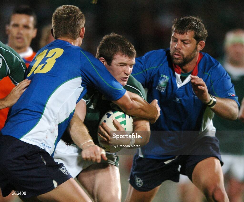9 September 2007; Gordon D'Arcy, Ireland, is tackled by Bratley Langenhoven, left, and Jacques Nieuwenhuis, Namibia. 2007 Rugby World Cup, Pool D, Ireland v Namibia, Stade Chaban Delmas, Bordeaux, France. Picture credit; Brendan Moran / SPORTSFILE