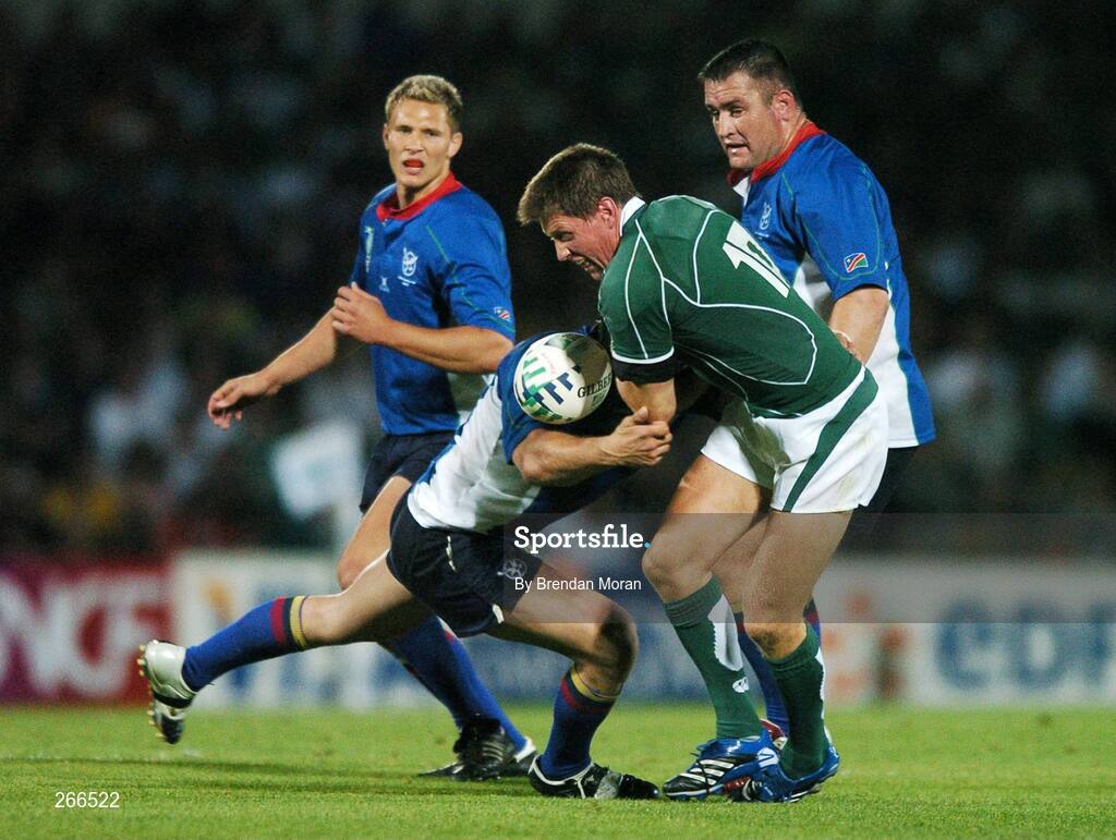 9 September 2007; Ronan O'Gara, Ireland, loses possession in a tackle by Michael MacKenzie, Namibia. 2007 Rugby World Cup, Pool D, Ireland v Namibia, Stade Chaban Delmas, Bordeaux, France. Picture credit; Brendan Moran / SPORTSFILE