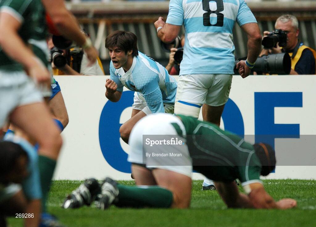 30 September 2007; Lucas Borges, Argentina, celebrates scoring his side's first try as Ireland's Denis Leamy lies dejected. 2007 Rugby World Cup, Pool D, Ireland v Argentina, Parc des Princes, Paris, France. Picture credit; Brendan Moran / SPORTSFILE