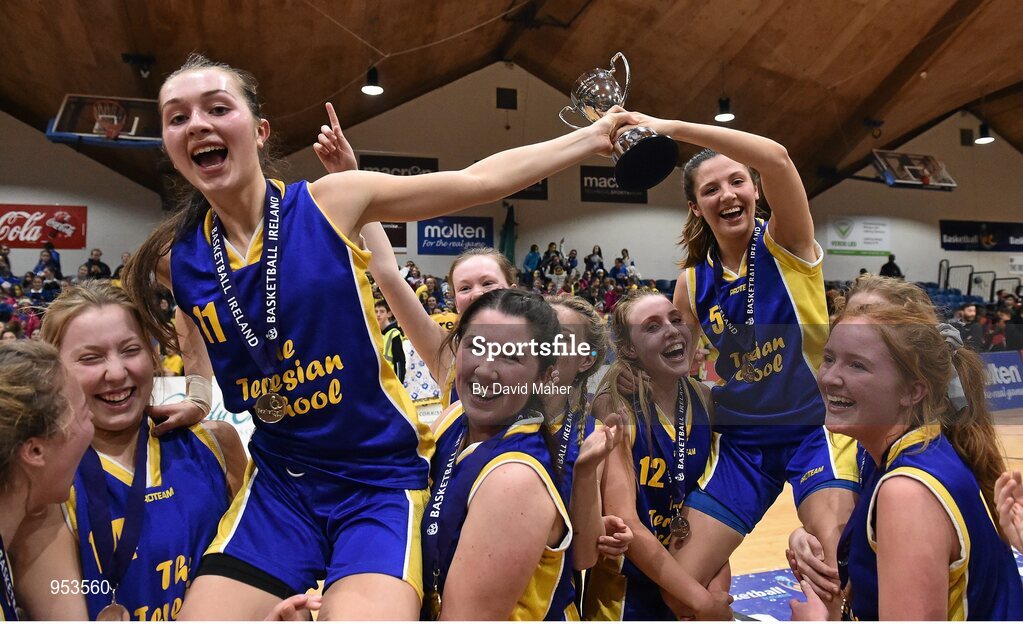 20 January 2015;  The Teresian School joint captains Allison McGrath, left, and Sophie Barron are lifted shoulder high by their team-mates at the end of the game. All-Ireland Schools Cup U19B Girls Final, The Teresian School v Glanmire Community College, National Basketball Arena, Tallaght, Dublin. Picture credit: David Maher / SPORTSFILE