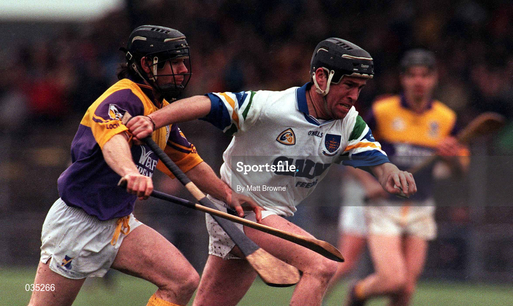 27 February 2000; Dave Bennett of Waterford in action against Sean Flood of Wexford during the Church & General National Hurling League Division 1B Round 2 match between Waterford and Wexford at Walsh Park in Waterford. Photo by Matt Browne/Sportsfile