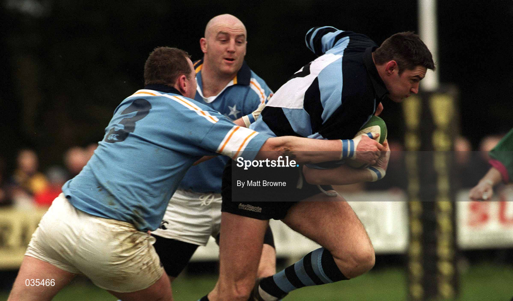 13 February 2000; Eddie Halvey of Shannon breaks through the tackle of Robert Laffan, 3, and Keith Wood of Garryowen during the AIB All-Ireland League Division 1 match between Garryowen and Shannon at Dooradoyle in Limerick. Photo by Matt Browne/Sportsfile