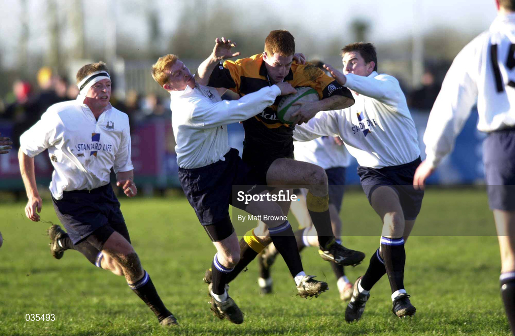 4 december 1999; Eoin Brennan of Buccaneers, is tackled by Anthony Horgan, left, and Cian Mahony of Cork Constitution during the AIB Rugby League Division 1 match between Buccaneers and Cork Constitution at Buccaneers RFC in Athlone, Westmeath. Photo by Matt Browne/Sportsfile