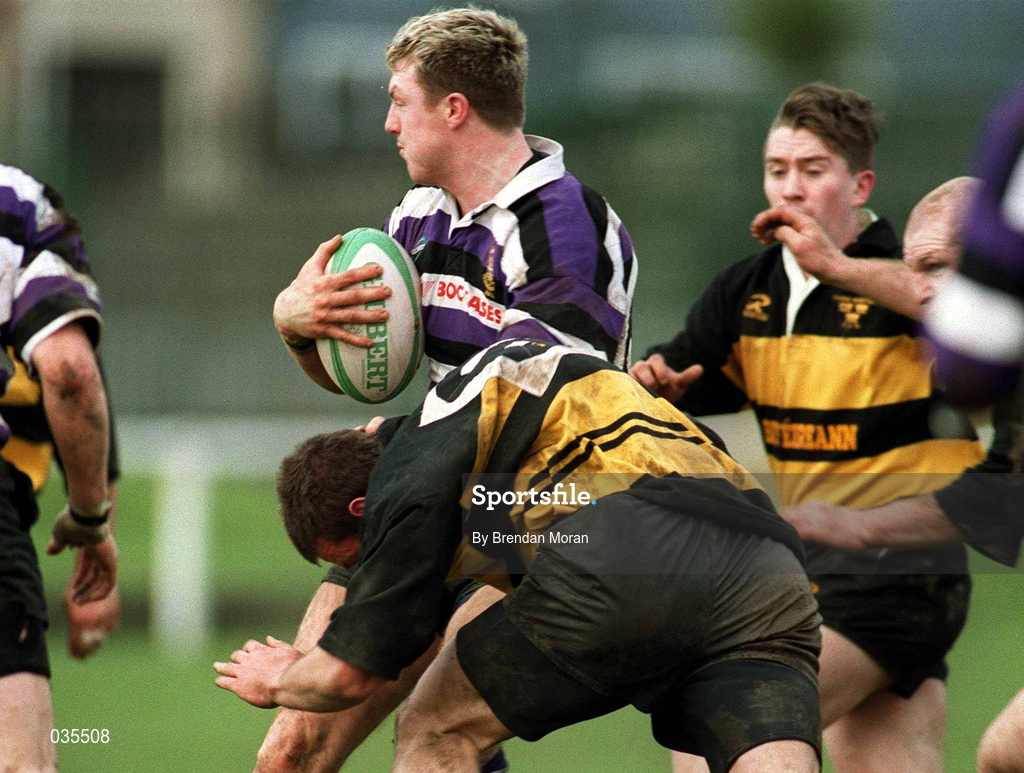 12 February 2000; Eric Miller of Terenure College in action against Ian Dillion of Young Munster during the AIB League Division 1 match between Young Munster and Terenure College at Tom Clifford Park in Limerick. Photo by Brendan Moran/Sportsfile