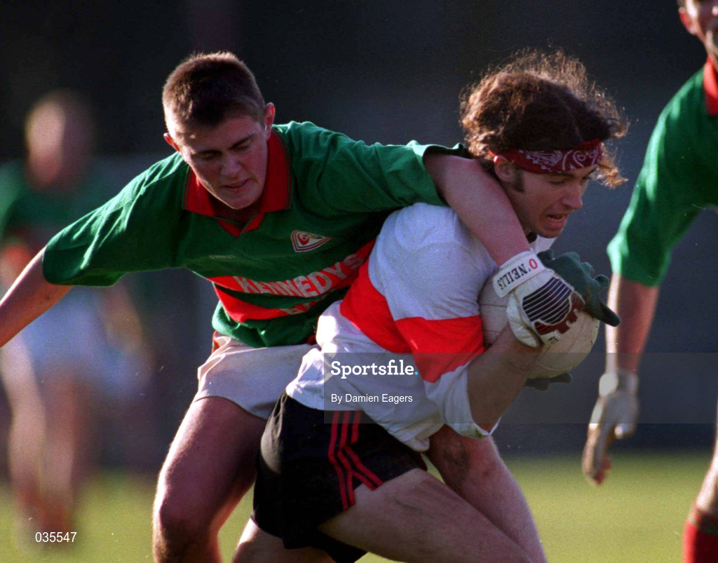 20 November 1999; Fionan Kelleher of UCC in action against Aidan Power of Rathgormack during the AIB Munster Senior Club Football Championship Semi-Final match between Rathgormack and UCC at Páirc Uí Rinn in Cork. Photo by Damien Eagers/Sportsfile